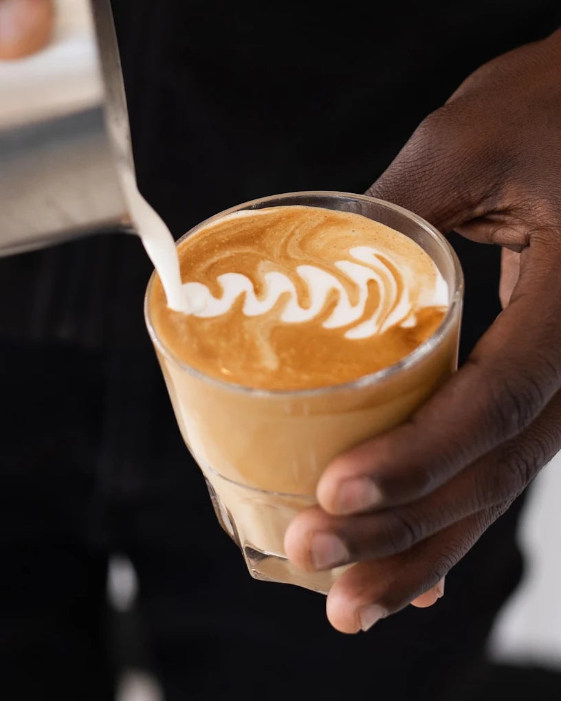 A barista training session — hands, tamper and portafilter